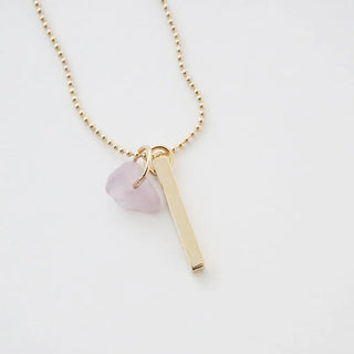 Karma Crystal + Bar Necklace with rose quartz and gold vertical bar on a delicate ball chain for manifesting intentions.