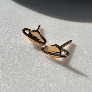 Gleaming mini planet stud earrings, showcasing a shiny planet design perfect for a cosmic touch to your style.