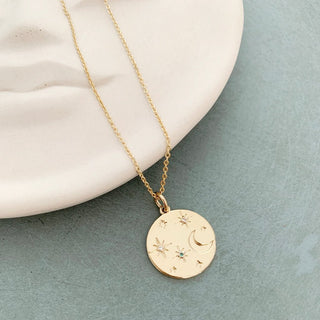 Stargazer pendant necklace featuring a crescent moon and stars with tiny crystals, adjustable chain, perfect for layering.