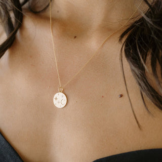 Stargazer Pendant Necklace featuring night sky objects and crystals, adjustable chain 18"-21", perfect for layering.