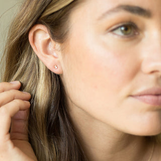 Honeycat Crystal Baguette Studs worn by a model.