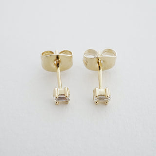 Gold-tone Crystal Baguette Studs, shown close up.
