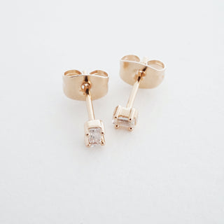 Rose-gold-tone Crystal Baguette Studs, shown close up.