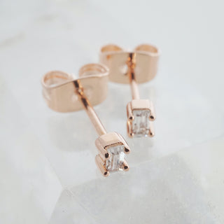 Rose-gold-tone Crystal Baguette Studs, shown close up.