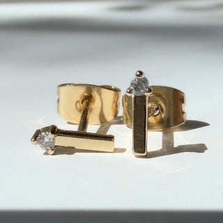 Gold-tone Crystal Matchstick Stud Earrings, shown close up.