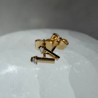 Gold-tone Crystal Matchstick Stud Earrings, shown close up.