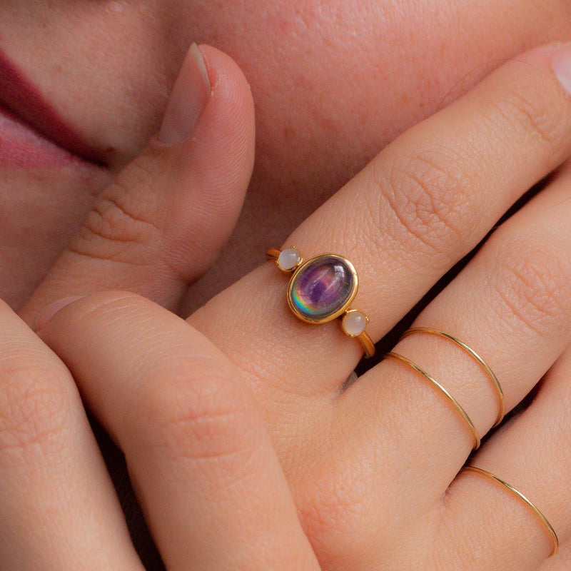 Bejeweled mood ring with color-changing stone and moonstones, perfect for stacking or solo wear.