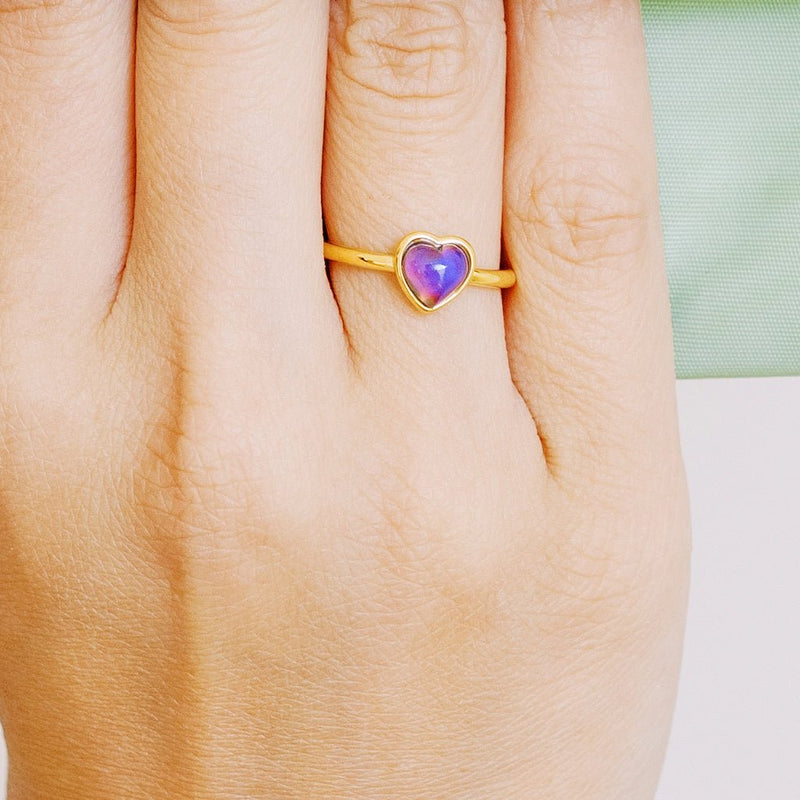 Heart-shaped mood ring in gold with shifting stone, perfect for stacking or wearing solo, measuring 7mm x 7mm.
