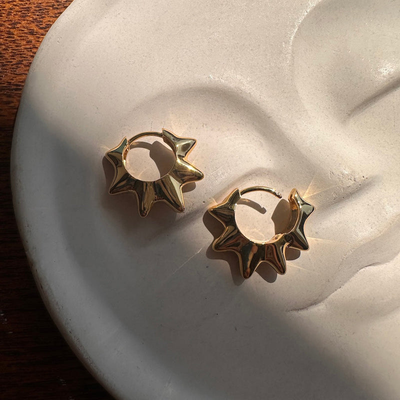 Gorgeous Love & Light Hoops featuring gently curved spears for an edgy yet polished look, perfect for any occasion.