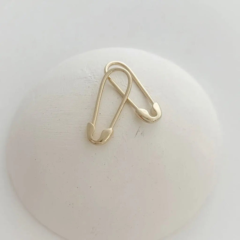 Mini safety pin hoop earrings: lightweight and stylish silhouette, perfect for everyday wear.