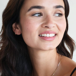 Honeycat Starlight Wand Earrings worn by a model.
