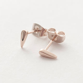 Rose-gold-tone Tusk Droplet Stud Earrings, shown close up.